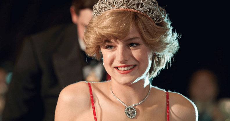 Emma Corrin as PRincess Diana in a red strappy dress, bouffant hair and tiara