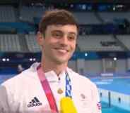 Tom Daley with his Olympic medal round his neck