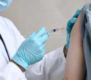 Doctor injects person with a vaccine for HIV