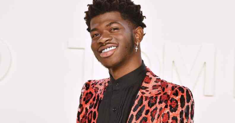 Lil Nas X attends the Tom Ford AW/20 Fashion Show at Milk Studios in gorgeous pink cheetah or leopard print outfit