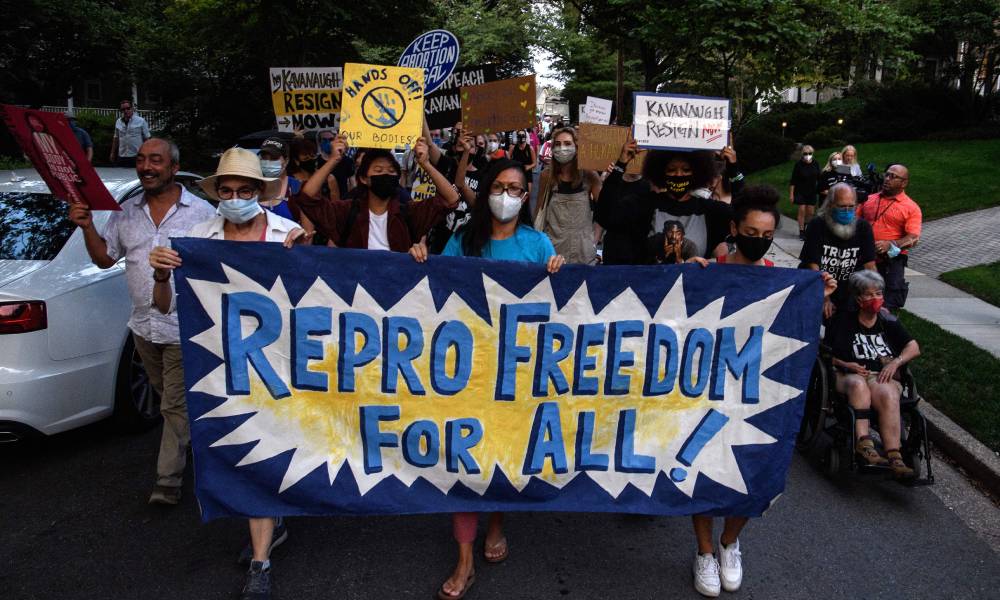 Activists march to US supreme court justice Brett Kavanaugh's house, following the court's decision to uphold Texas' stringent abortion law.