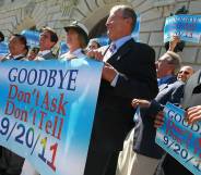 Local leaders and former military members hold a banner during a conference marking the end of "Don't Ask, Don't Tell" on 20 September 2011