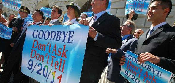 Local leaders and former military members hold a banner during a conference marking the end of "Don't Ask, Don't Tell" on 20 September 2011