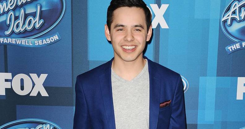 David Archuleta attends FOX's "American Idol" finale for the farewell season at Dolby Theatre in a blue suit jacket and grey shirt