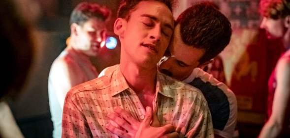 Olly Alexander in It's a Sin, embracing a man