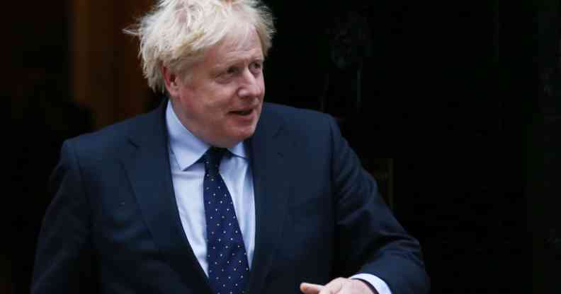 Boris Johnson walks out the door of Number 10