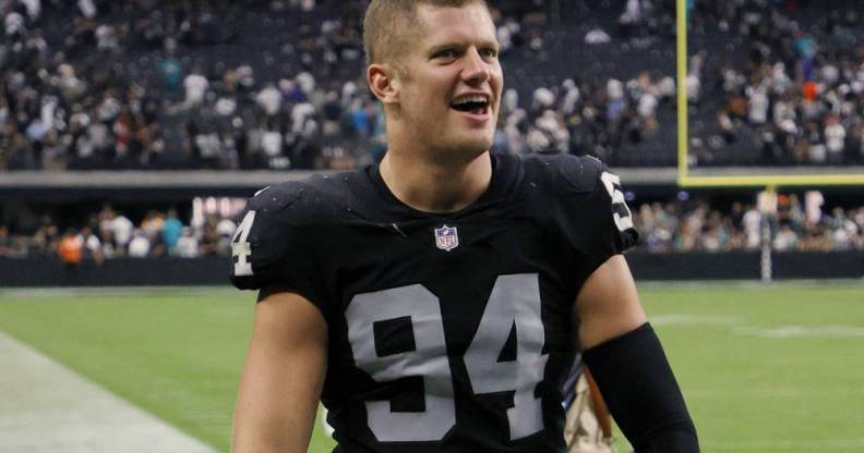 Carl Nassib of the Las Vegas Raiders celebrates as he walks off the field after the team's victory over the Miami Dolphins