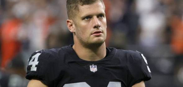 Carl Nassib exits the field after the Las Vegas Raiders lost to the Chicago Bears