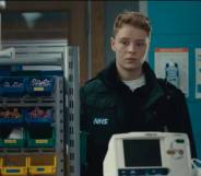 A still from Casualty showing Sah, a new recruit to the paramedic team. Sah is Casualty's first trans recurring character, and they are played by Arin Smethurst.