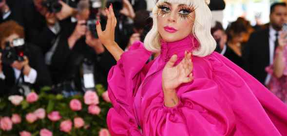 Lady Gaga in a cerise dress at the Met Gala in 2019