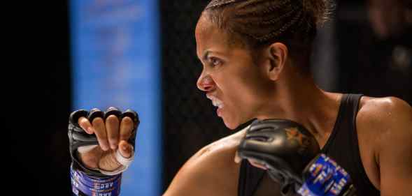 Halle Berry in boxing gloves, snarling