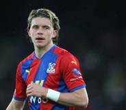 Crystal Palace's Conor Gallagher standing on a football pitch during a match against Aston Villa