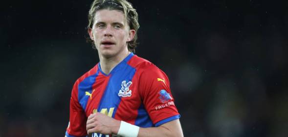 Crystal Palace's Conor Gallagher standing on a football pitch during a match against Aston Villa