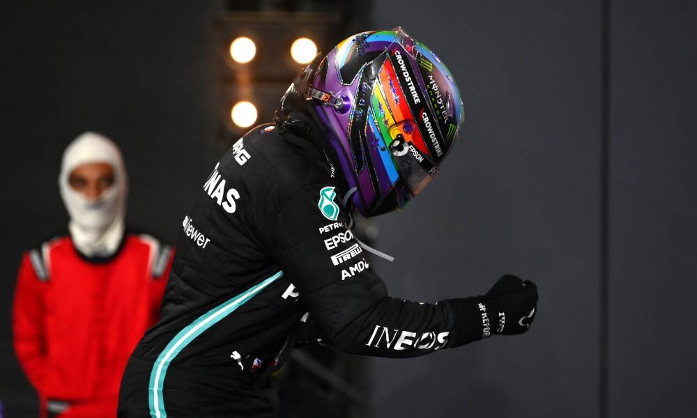 Lewis Hamilton wears a Pride helmet as he celebrates his win at the F1 Grand Prix of Saudi Arabia