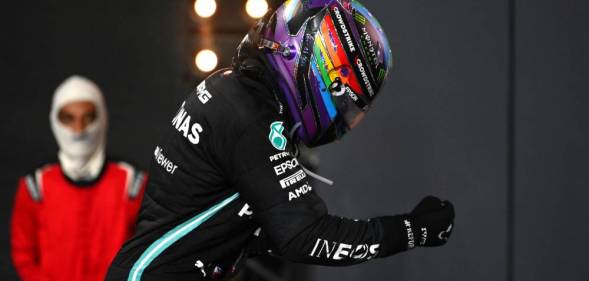 Photo of Lewis Hamilton wearing a Pride helmet as he celebrates his win at the F1 Grand Prix of Saudi Arabia