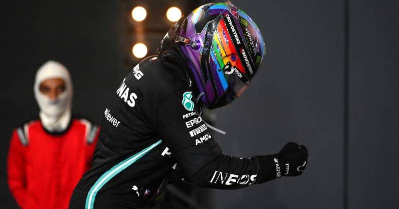 Photo of Lewis Hamilton wearing a Pride helmet as he celebrates his win at the F1 Grand Prix of Saudi Arabia