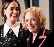 Sarah Paulson and Holland Taylor are seen smiling at the camera while attending the 2020 Vanity Fair Oscar party