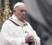 Pope Francis claps his hands at a mass