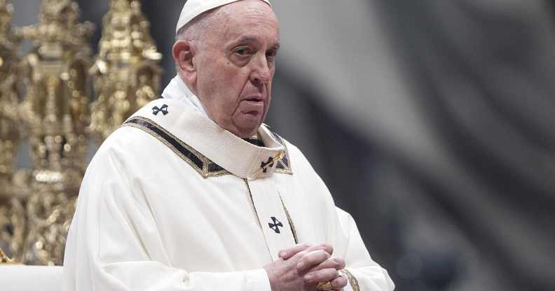 Pope Francis claps his hands at a mass