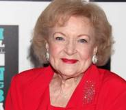 Betty White seen dressed in all red with red lipstick