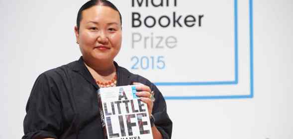 Hanya Yanagihara holding her book A Little Life