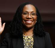 Ketanji Brown Jackson, a Black woman, raises her hand as she is sworn in before a Senate Judiciary Committee hearing