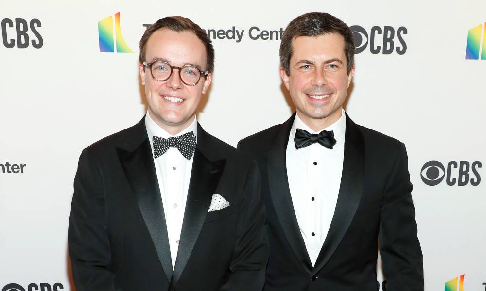 Pete and Chasten Buttigieg, who are husbands, are dressed in suits and ties for an event