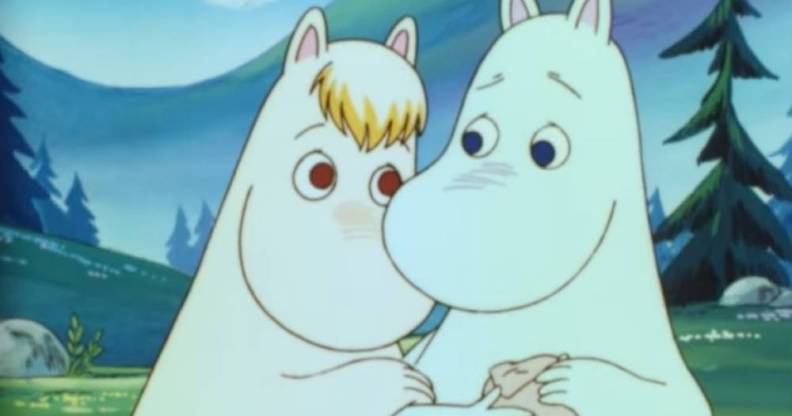 Two white Moomin characters embrace each other