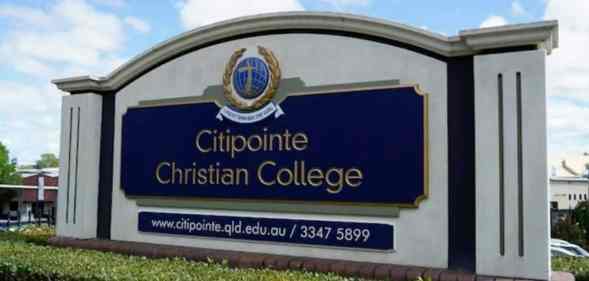 A sign for Citipointe Christian College in Australia surrounded by shrubbery