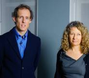 Nigel and Sally Rowe, parents from the Isle of Wight in England, stand in a room