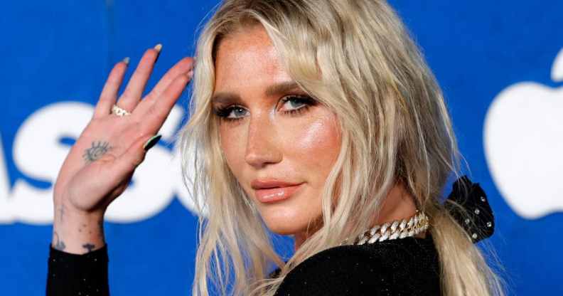 Kesha waving at the camera