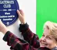 Sandi Toksvig holding up a blue plaque