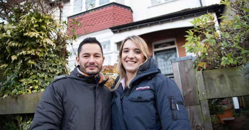 Hannah and Jake Graf pose outside their London home