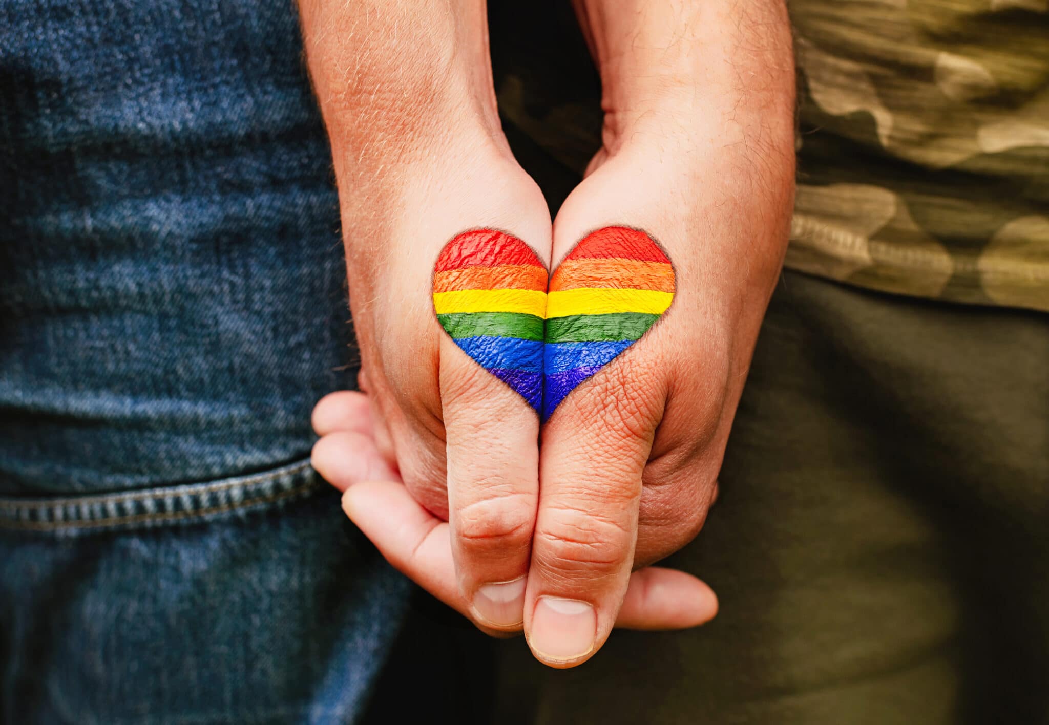 A gay couple holding hands. The picture shows solidarity with the people of Ukraine