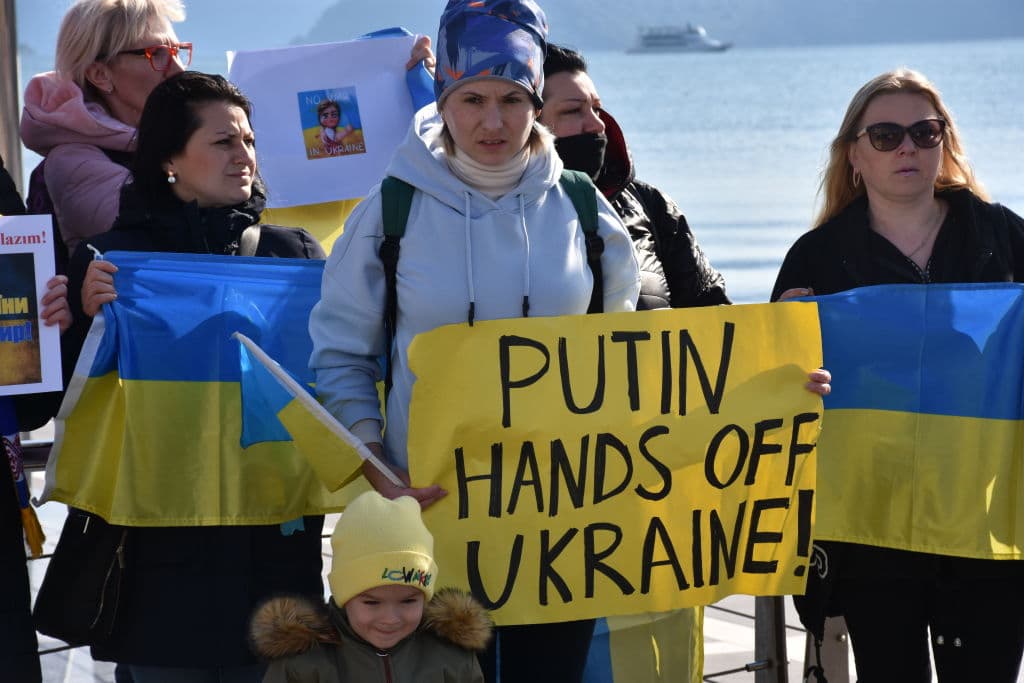 Ukrainians living in Mugla ,holding banners and flags, gather to protest Russia's attack on Ukraine