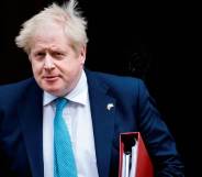 Prime Minister Boris Johnson leaves Cabinet meeting at 10 Downing Street on 23 March 2022 in order to attend the PMQ session at the House of Commons