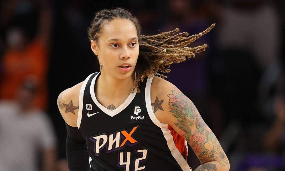 Brittney Griner, a basketball player, is seen wearing a dark uniform for her WNBA team