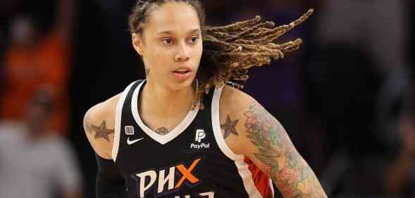 Brittney Griner, a basketball player, is seen wearing a dark uniform for her WNBA team