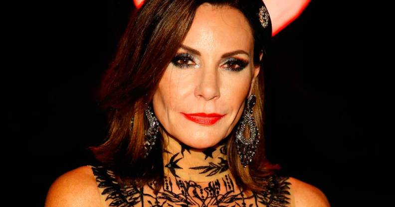 Luann de Lesseps, who appeared on the Real Housewives of New York City, wears a black lacy outfit during a Halloween ball