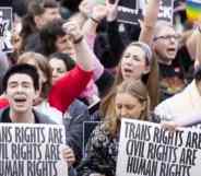 People holding up signs that read "Trans rights are civil rights are human rights"