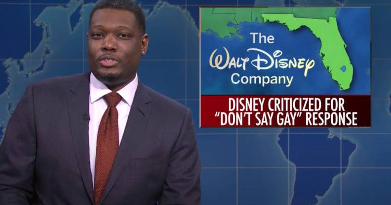 SNL castmate Michael Che during the Weekend Update segment with a picture of Florida alongside the Walt Disney Company logo and a news bulletin about the state's "Don't Say Gay" bill