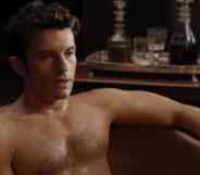 Jonathan Bailey shirtless in a bathtub