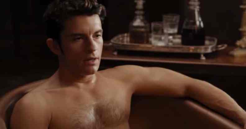 Jonathan Bailey shirtless in a bathtub