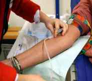 A person preps another individual to donate blood