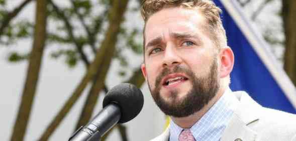 Alabama state representative Neil Rafferty speaks at a podium