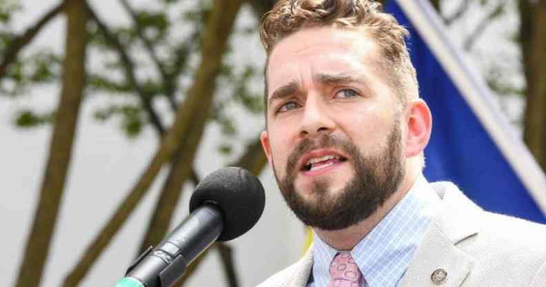 Alabama state representative Neil Rafferty speaks at a podium