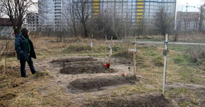 Graves with bodies of civilians next to apartments blocks in the recaptured by the Ukrainian army Bucha city near Kyiv, Ukraine, 04 April 2022.