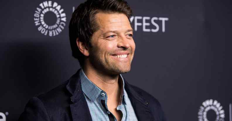 Misha Collins smiles on the red carpet