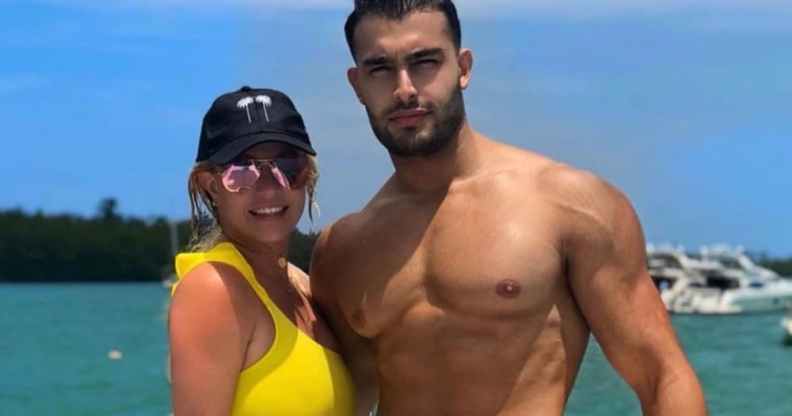 Sam Asghari and Britney Spears pose by the sea