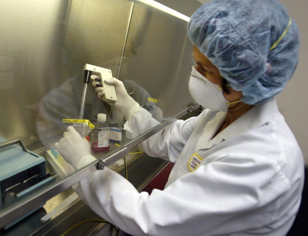 Assistant Scientist Sigrun Haugerud demonstrates how to prepare a test sample, the first step taken when testing for the monkeypox virus. 